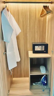 a small cabinet with a radio in a room at Luxury studio near Nai Harn beach in Rawai Beach