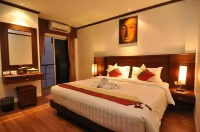 a bedroom with a large bed in a room at Hemingway's Hotel in Patong Beach