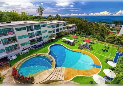 an aerial view of a resort with a swimming pool at Karon Butterfly Residence in Kata Beach