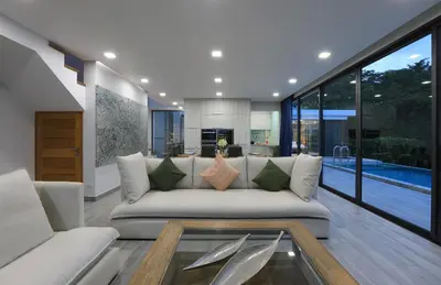 a living room with a couch and a table at 4BDR Sugar Villa 2 in Kamala Beach