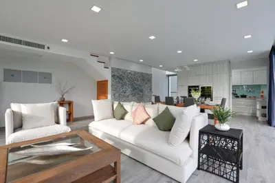 a living room with a white couch and a table at 4BDR Sugar Villa 2 in Kamala Beach