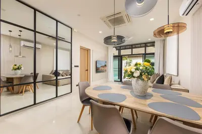 a dining room with a table and chairs at VILLA Hinako Private Pool Nai Harn Beach in Rawai Beach