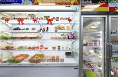 an open refrigerator filled with lots of food at Nai Harn Condominium in Rawai Beach