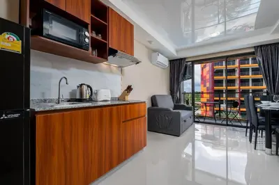a kitchen with a sink and a counter top at 1 BR apartment 777 Beach Condotel in Mai Khao Beach