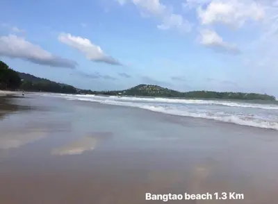 a beach with the ocean at Bangtao Corner in Bang Tao Beach