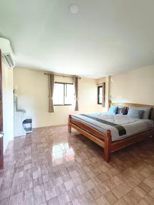 a bedroom with a large bed in a room at บ้านสวยกานต์ชนิต in Ko Yao Noi