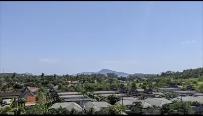 arial view of a town with houses and trees at Charming Beachside Studio in Rawai Beach