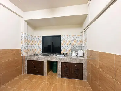 a kitchen with a counter in a room at Ganchanid House in Ko Yao Noi