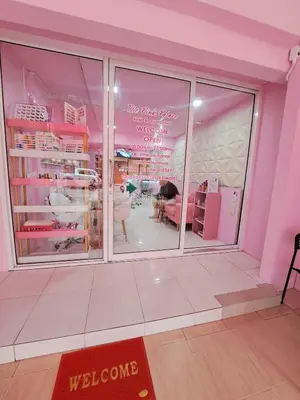 a pink room with a store with a window at The pink palace in Karon Beach