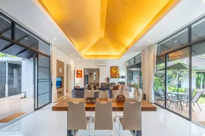a dining room and living room with a table and chairs at High End Imported Furniture Loch Palm Golf Course V145 in Kathu
