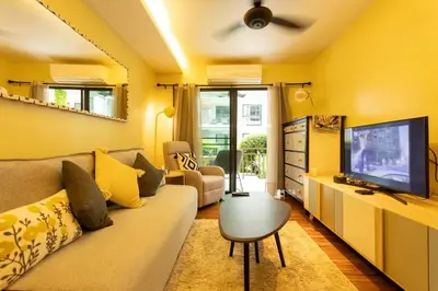 a living room with a couch and a tv at Neatest Apartment 50m To Main Street And Beach C149 in Rawai Beach