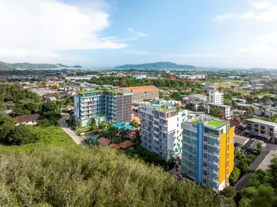 an aerial view of a city with buildings at The Blue Mavi Hotel in Chalong
