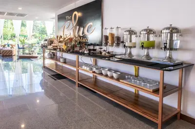 a coffee shop with a counter with at The Blue Mavi Hotel in Chalong