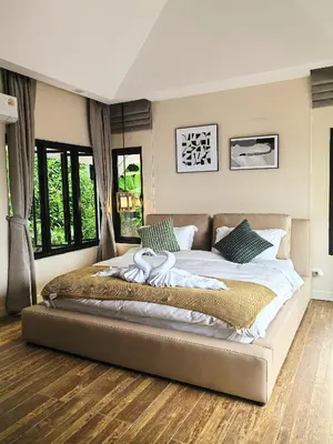 a bedroom with a large bed in a room at modern hill villa \u5c71\u95f4\u89c2\u6d77\u79c1\u4eba\u522b\u5885 in Patong Beach