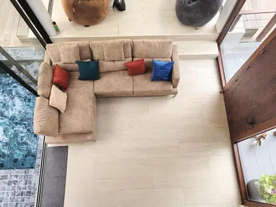an overhead view of a couch with colorful pillows at modern hill villa \u5c71\u95f4\u89c2\u6d77\u79c1\u4eba\u522b\u5885 in Patong Beach