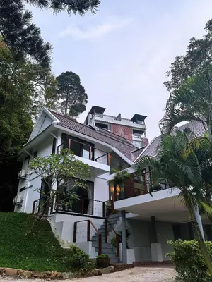 a large white house with trees in front of it at modern hill villa \u5c71\u95f4\u89c2\u6d77\u79c1\u4eba\u522b\u5885 in Patong Beach