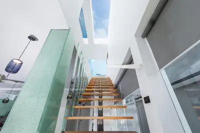 a stairway in a building with wooden steps at VILLA Satori 4BR by Tropiclook in Rawai Beach