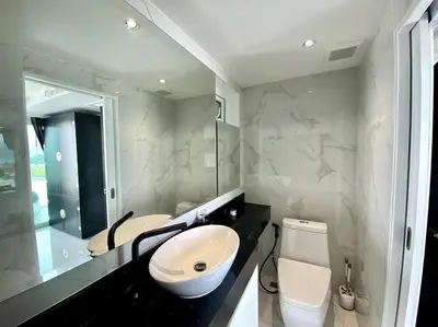 a bathroom with a sink and a toilet at Kata Ocean View 1 bedroom 50 m2 in Kata Beach