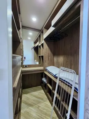 a small room with a bunk bed and a mirror at One bedroom apartment Calypso Garden in Phuket Town