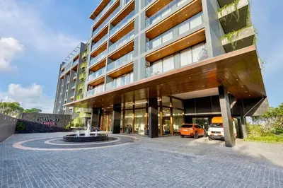 a large building with a fountain in front of it at One bedroom apartment Calypso Garden in Phuket Town