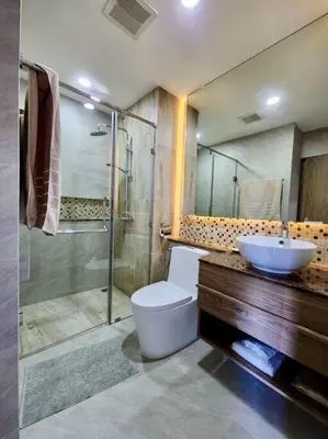 a bathroom with a sink and a toilet and a shower at One bedroom apartment Calypso Garden in Phuket Town
