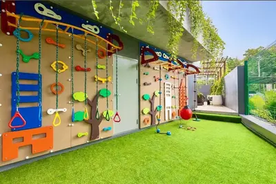 an indoor play room with a climbing wall at One bedroom apartment Calypso Garden in Phuket Town