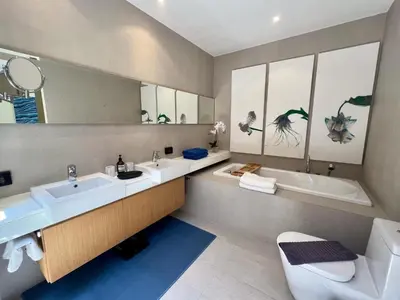 a bathroom with two sinks and a tub and a toilet at Pool villa at The Residence near BangTao beach in Bang Tao Beach