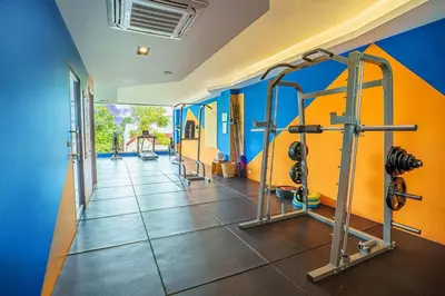 a gym with several tread machines in a room at Brand New Luxury 3BR with Private Hammam in Chalong