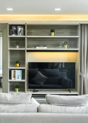 a living room with two white couches in front of a tv at Brand New Luxury 3BR with Private Hammam in Chalong