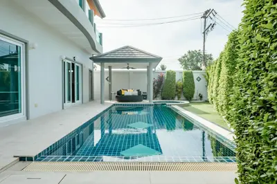 a swimming pool in a house with a gazebo at Luxury 4 Bedroom Beach House in Ban Saiyuan (1)