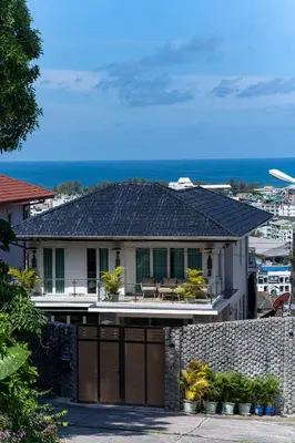 a house with a gate and a fence at \u542b\u65e9\u9910\u9001\u63a5\u673a Phuket patong 4Bedrooms seaview Pool villa in Patong Beach