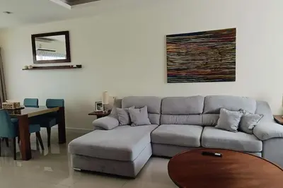 a living room with a couch and a table at Bangtao Beach 600m Laguna 3BDR 3,5bath with Jacuzzi and BBQ up to 8 guests 5 nights Free taxi in Phuket