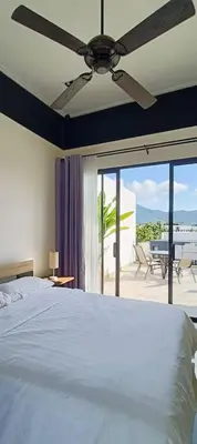 a bedroom with a bed and a ceiling fan at Bangtao Beach 600m Laguna 3BDR 3,5bath with Jacuzzi and BBQ up to 8 guests 5 nights Free taxi in Phuket