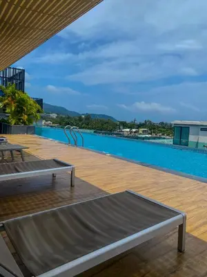 a pool on the roof of a building at Private apartments near Kata beach in Kata Beach