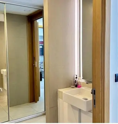 a bathroom with a sink and a mirror at Oceanstone condo Bangtao Beach in Bang Tao Beach