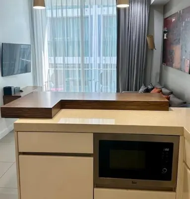 a kitchen with a counter top with a microwave at Oceanstone condo Bangtao Beach in Bang Tao Beach