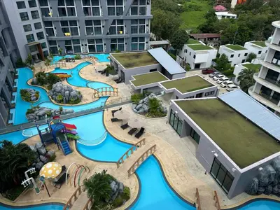 an aerial view of a water park in a city at Modern apartment on Naiharn Beach B404 in Rawai Beach