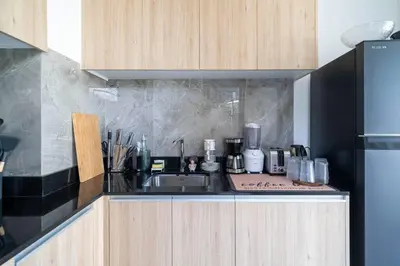 a kitchen with a sink and a counter top at \u9038\u6d77\u306e\u5922 Laguna\u4e09\u5367\u5ba4\u79c1\u4eba\u6cf3\u6c60\u522b\u5885 in Ban Phru Champa