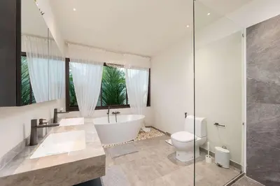 a bathroom with a tub and a toilet and a shower at Villa Plunge Modern 2-Bedroom with Private Pool in Rawai Beach