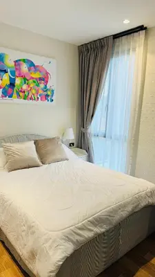 a bedroom with a large bed with a window at The Title Halo 1 Naiyang beach in Nai Yang Beach