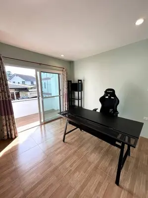 a ping pong table in a living room with at Villa Patong Beach in Patong Beach