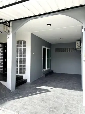a large white building with a porch and a patio at Villa Patong Beach in Patong Beach
