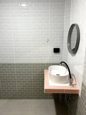 a bathroom with a sink and a mirror at Villa Patong Beach in Patong Beach