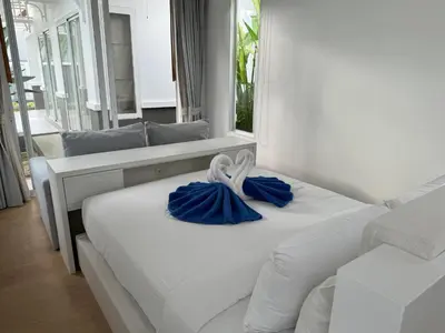 a bedroom with two beds with blue towels on them at Luxury villa Kamala Garden View by Lofty in Kamala Beach