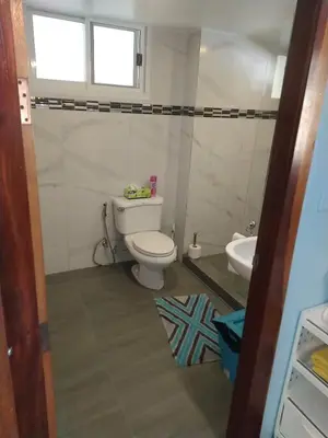 a bathroom with a toilet and a sink at 2,5 Zimmerwohnung mit Pool und Pavillon in Rawai Beach