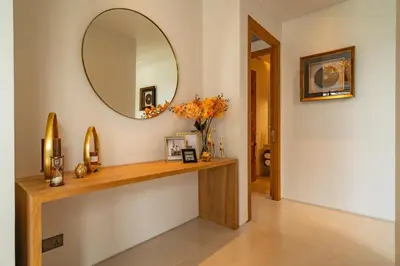 a room with a mirror and a wooden table at Modern 3BR Pool Villa at Anchan Flora in Bangtao in Bang Tao Beach