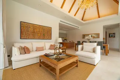 a living room with a white couch and a coffee table at Modern 3BR Pool Villa at Anchan Flora in Bangtao in Bang Tao Beach