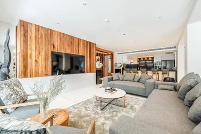 a living room with couches and a tv at Private Pool Residence at Surin Beach in Surin Beach