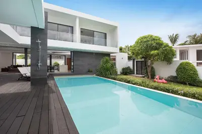 a swimming pool in front of a house at Ultra-Modern Tropical Pool Villa in Phuket