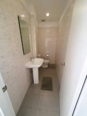 a white bathroom with a sink and a toilet at Modern pool villa 3 bedrooms in Rawai Beach